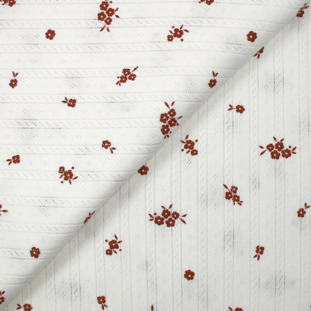 Jersey pointelle coton imprimé fleurs brique fond blanc cassé