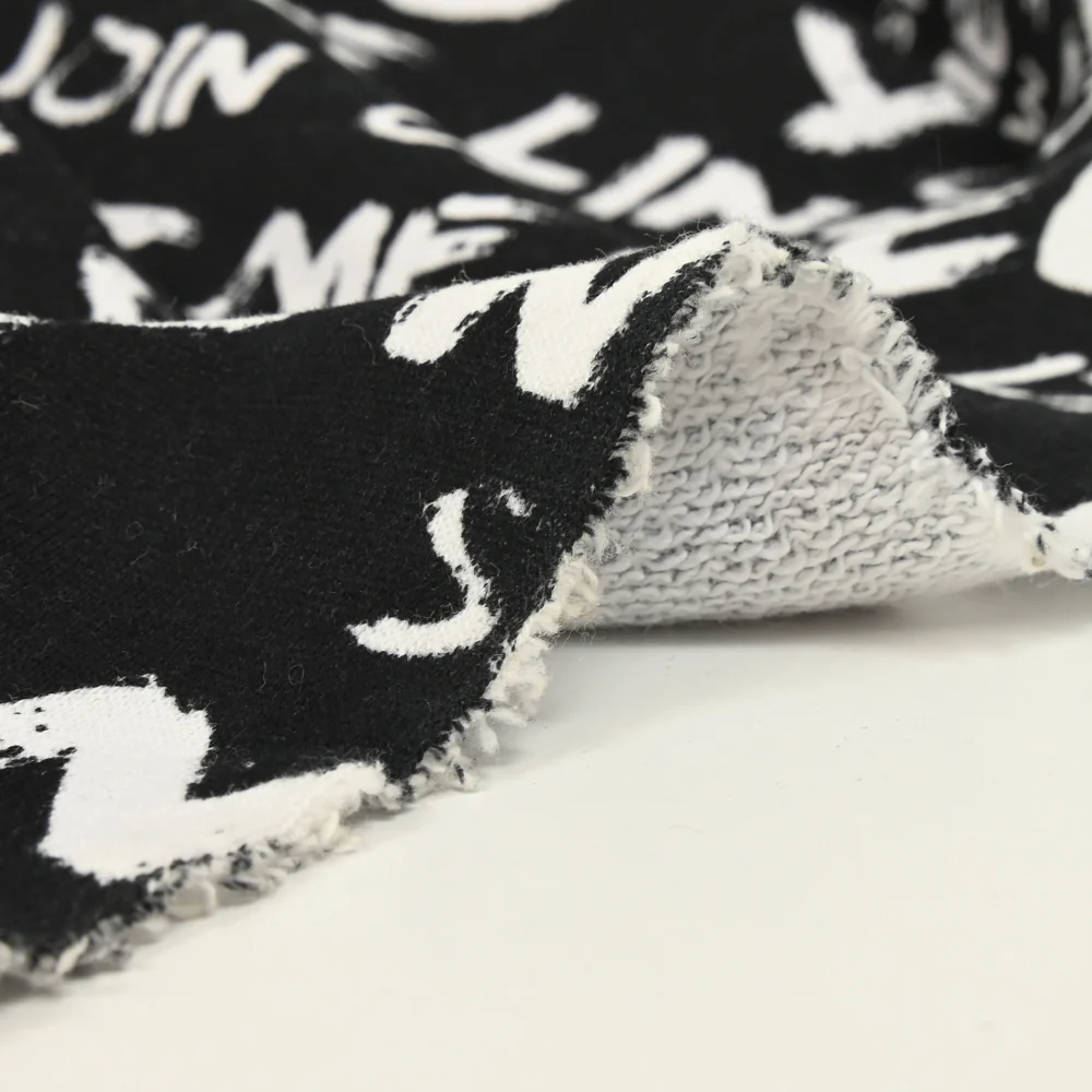 Molleton coton french terry imprimé typo fond noir - Image 8