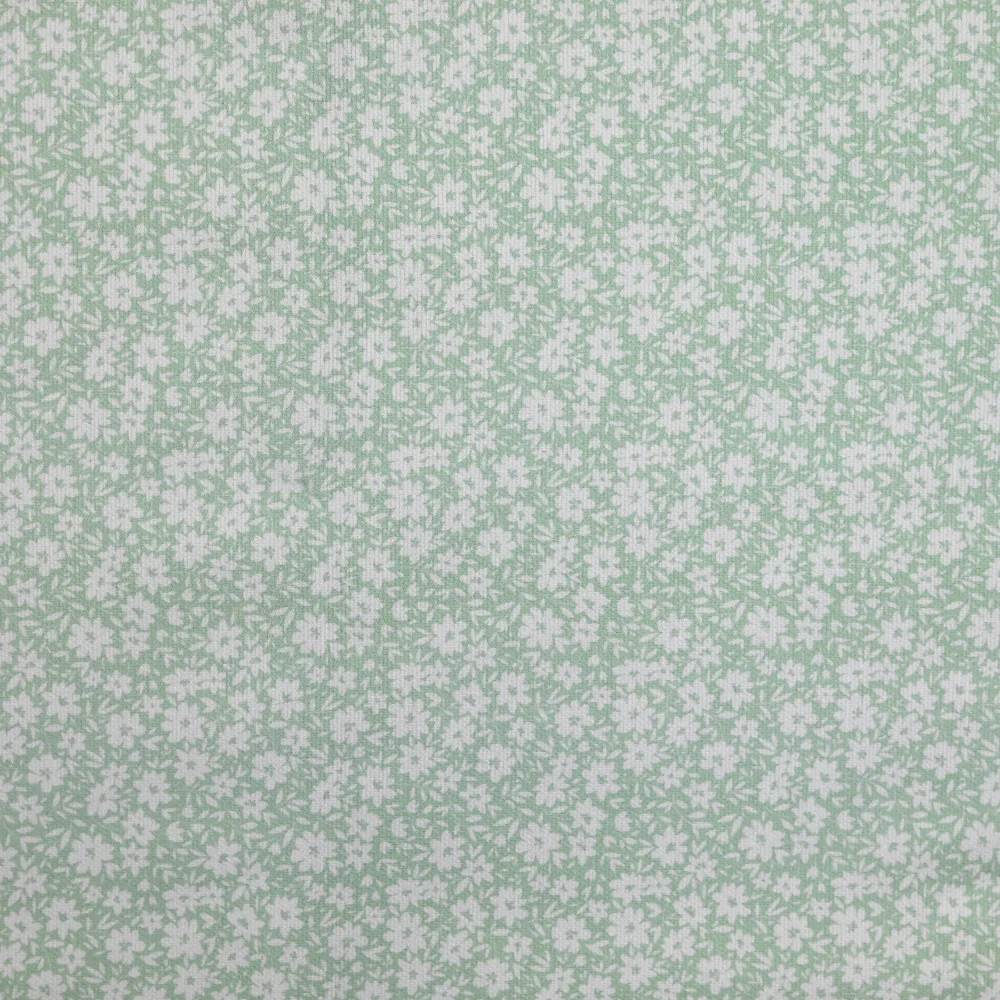 Piqué de coton imprimé fleurs printanière fond vert