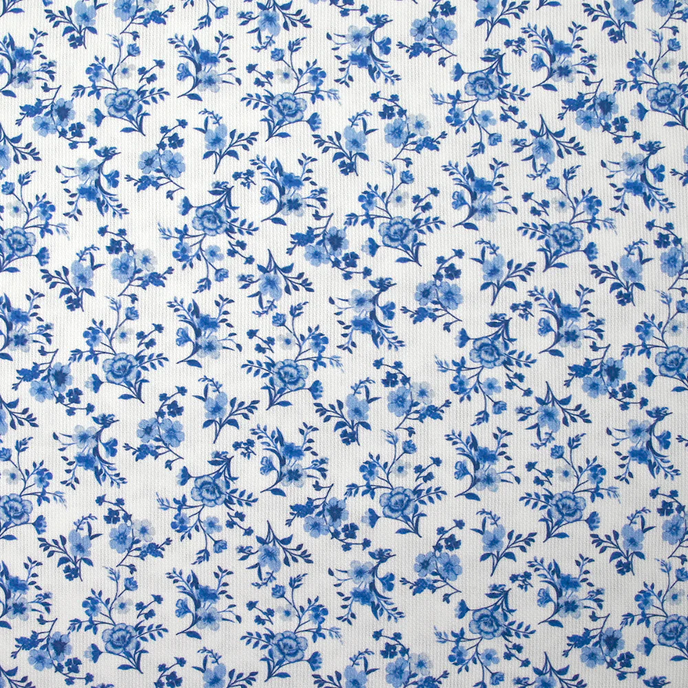 Piqué de coton imprimé les fleurs de Louna bleu fond blanc