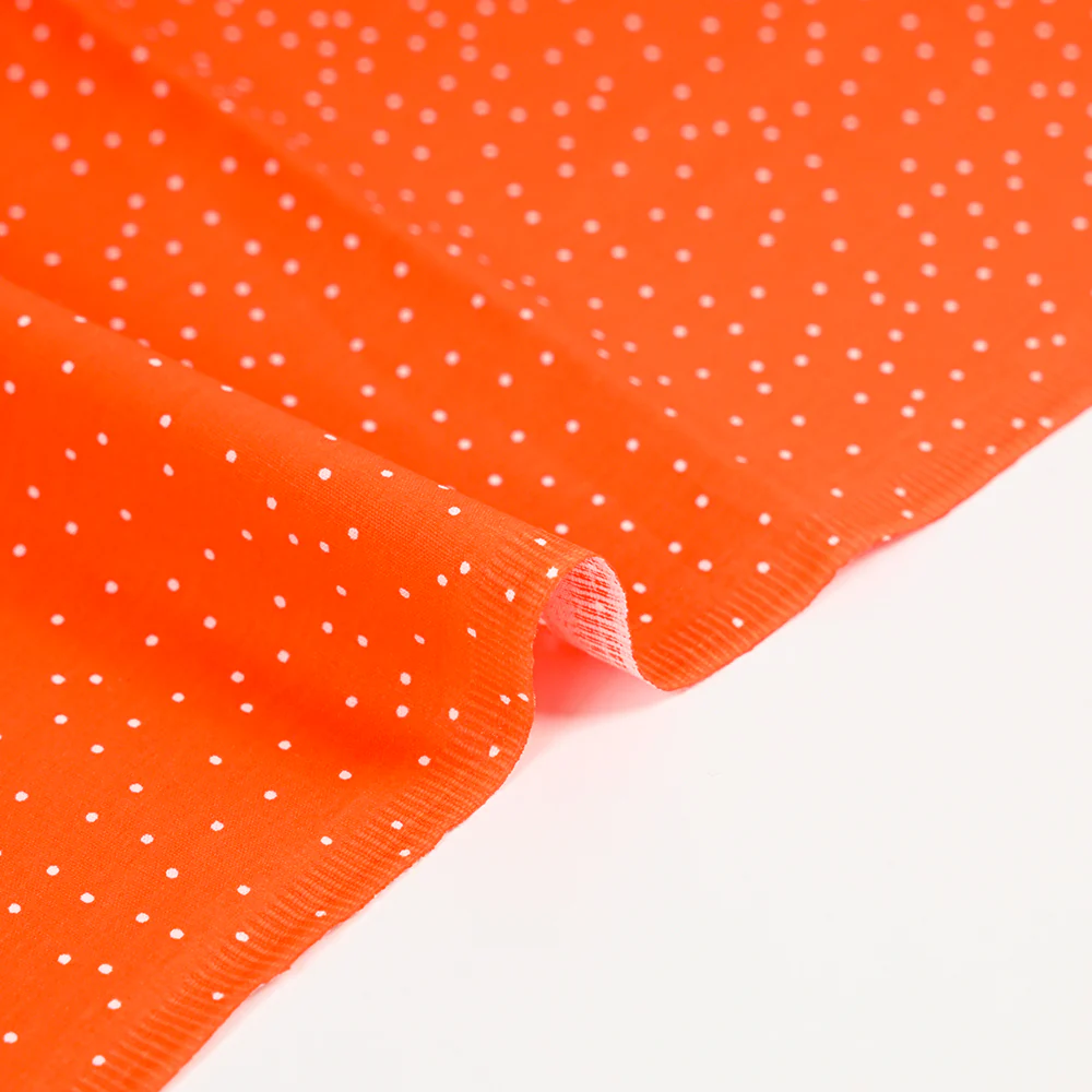 Popeline de coton imprimée confettis fond orange - Image 6